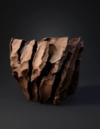 3d model: rugged rock formation with deep angular grooves and brown gray stone